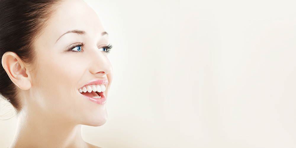 Smiling woman with beautiful cosmetic dentistry 
