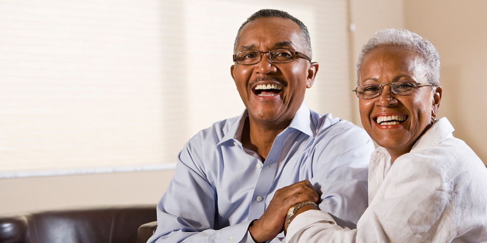 Cheery couple with beautiful dental implants