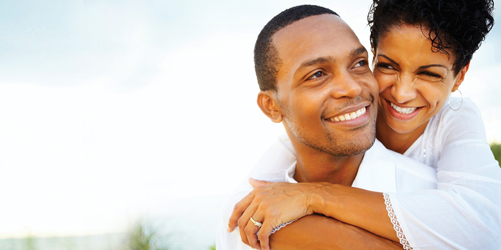 Smiling couple feeling relaxed about getting dental anesthesia 